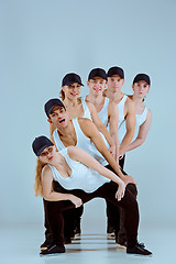 Image showing Group of men and women dancing hip hop choreography