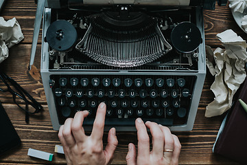 Image showing Writer typing with retro writing machine.