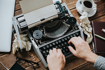 Image showing Writer typing with retro writing machine.