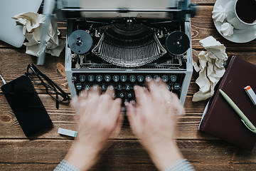 Image showing Writer typing with retro writing machine.