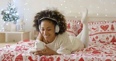 Image showing Attractive young woman relaxing at Christmas