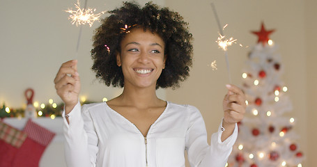 Image showing Happy young woman celebrating Christmas