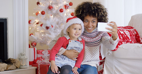 Image showing Woman and child posing for camera phone