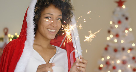 Image showing Cute friendly young woman celebrating Christmas