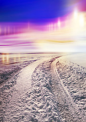 Image showing Snow covered road and polar lights