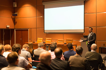 Image showing Business speaker giving a talk in conference hall.