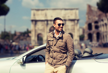 Image showing happy man driving cabriolet car over city of rome