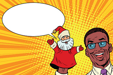 Image showing African businessman with hand puppet Santa Claus