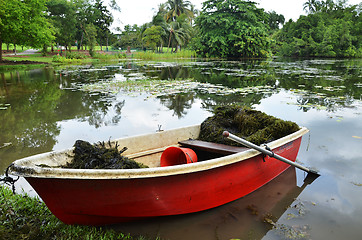 Image showing Red boat in Singapore Botanic Garden