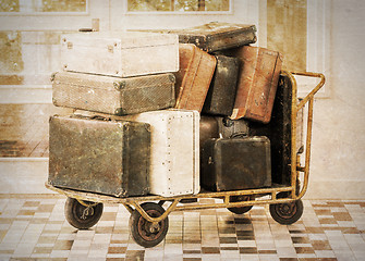 Image showing Trolley full of old luggage