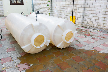 Image showing Cleaning plastic tanks volume of one cubic meter of drinking water, dirty rusty sediment