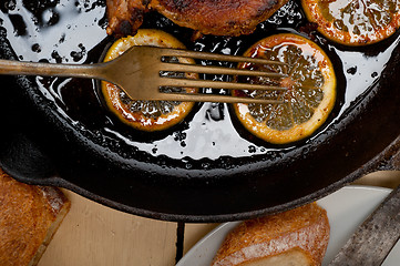 Image showing pork chop seared on iron skillet