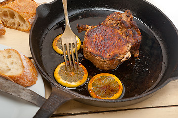 Image showing pork chop seared on iron skillet