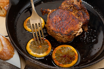 Image showing pork chop seared on iron skillet