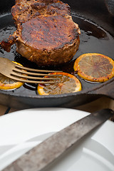 Image showing pork chop seared on iron skillet