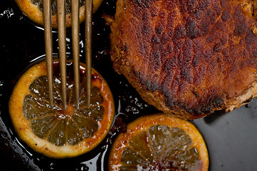 Image showing pork chop seared on iron skillet