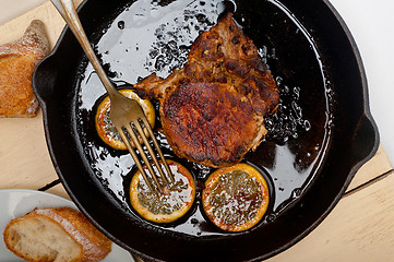 Image showing pork chop seared on iron skillet