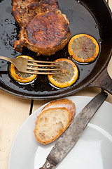 Image showing pork chop seared on iron skillet