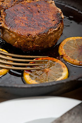 Image showing pork chop seared on iron skillet