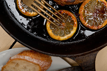 Image showing pork chop seared on iron skillet