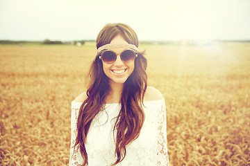 Image showing smiling young hippie woman on cereal field