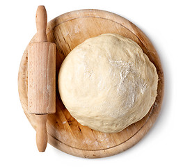 Image showing fresh raw dough on wooden board