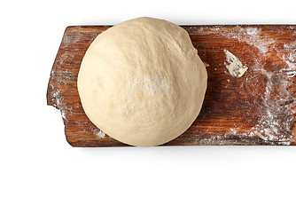 Image showing fresh raw dough on wooden board