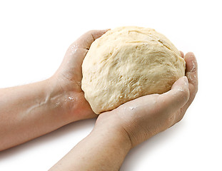Image showing fresh raw dough in bakers hands