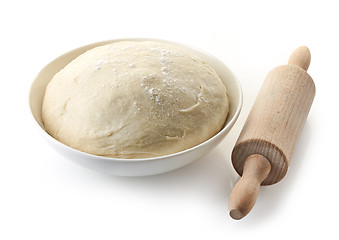 Image showing bowl of fresh dough and rolling pin