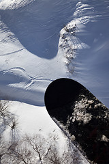 Image showing View from chair-lift on snowboard over off-piste slope