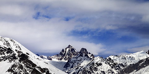 Image showing Panoramic view from ski slope on snow mountain in sun winter day