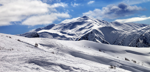 Image showing Off-piste slope and beautiful sky with clouds in sun evening