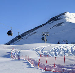 Image showing Gondola lift on ski resort at sun winter day