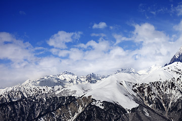 Image showing Snow winter mountains in clouds