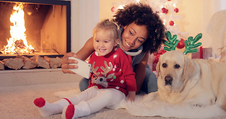 Image showing Happy family selfie portrait at Christmas