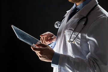 Image showing close up of doctor with tablet pc and stethoscope