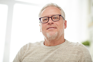 Image showing close up of smiling senior man in glasses