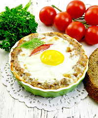 Image showing Tartlet meat with egg in pan on light board