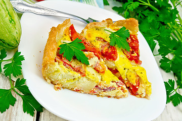 Image showing Flan with tomato and zucchini in plate on board