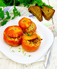 Image showing Tomatoes stuffed with bulgur in plate on board