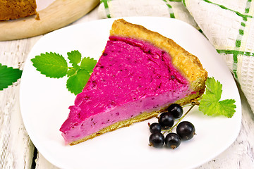 Image showing Pie of black currants in plate on light board