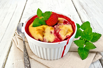 Image showing Pudding strawberry in bowl on board