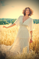 Image showing beautiful middle-aged woman dressed in white fashionable dress