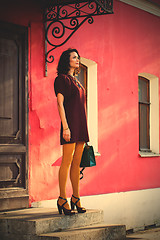 Image showing beautiful white woman in a burgundy dress