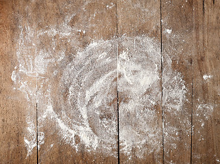 Image showing white flour on wooden table
