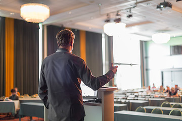 Image showing Public speaker giving talk at business event.