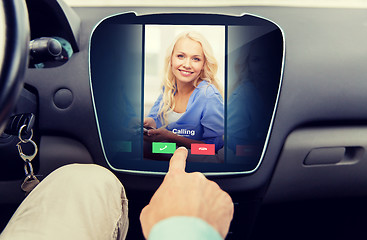 Image showing close up of man using phone application in car