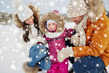 Image showing happy family with child in winter clothes outdoors