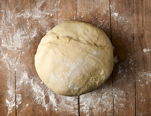 Image showing bowl of fresh dough on rustic wooden table