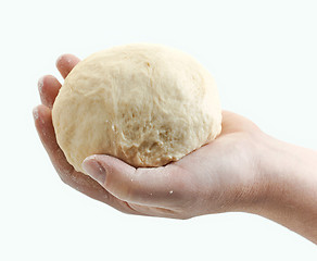 Image showing fresh raw dough in bakers hand